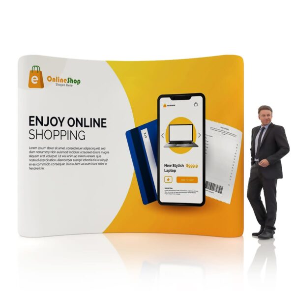A businessman stands beside a promotional display for an online shop. The display features a smartphone showing a shopping app with a laptop priced at $599.99, alongside credit cards. The background is yellow and white with Enjoy Online Shopping text.