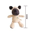 A beige and brown stuffed dog toy with floppy ears is shown next to a ruler indicating its height as 25 cm. The toy has Play Design embroidered on its front.