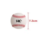 A white baseball with red stitching displaying a logo and the letters HIC. Next to the ball is a red line with the text 7.3 cm, indicating its diameter.