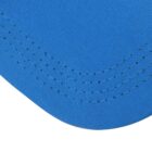 Close-up of blue fabric with decorative stitching along the curved edge.