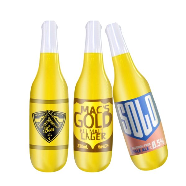 Three yellow beverage bottles with different labels: one with a black emblem, another with Macs Gold All Malt Lager, and the third with Solo Alcohol-Free Pale Ale 0.5%.