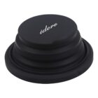 Collapsible black silicone cup lid with the brand name idero printed in white on the top. The lid has a tiered design and is shown in a folded position.