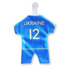 A small, blue and yellow sports jersey with the word UKRAINE and the number 12 printed on it. The jersey is hanging on a transparent suction cup hook.