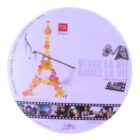 Round mouse pad featuring an Eiffel Tower design made of flowers, film reel illustration, and the text Vivez la vie, aimez la vie. Includes a small photo strip and the logo BBGR France. Pastel color scheme.