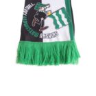A soccer scarf with green tassels featuring a cartoon character holding a green and white flag. The text around the character includes SHMISHU MATSUSHIMA and FUDTOBALL, set against a green, white, and black background.