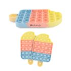 Two silicone pop fidget toys shaped like popsicles. They have rows of bubbles in pastel colors: yellow, pink, and blue. The top toy is a larger single piece, and the bottom shows two smaller identical toys.