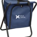A dark blue portable folding chair with a built-in storage pouch, featuring a zippered compartment on the back. The pouch has HELIX CAPITAL and a logo printed in white on the front. The chair has black metal legs and black straps.