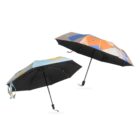 Two opened umbrellas with geometric patterns are shown against a white background. One has shades of blue and yellow, the other features orange and beige colors. Both have black canopies and handles.