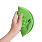 A hand holding a green, crescent-shaped stress ball with bubble-like textures. The stress ball is branded with the text CHESTNUT DENTAL alongside a logo featuring two stylized hands.