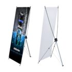 Two X-banners: One with a Gillette product advertisement featuring splashing water; the other is blank. Both are on tripod stands.