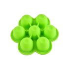 A green silicone mold with six round cavities, designed for making ice or other frozen treats. The mold has a flower-like shape with each cavity forming a petal.