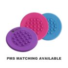 Three colorful push pop bubble fidget toys are displayed. Each circular toy has a grid of bubbles and comes in pink, blue, and purple. The purple toy features a logo in the corner. Text below reads PMS MATCHING AVAILABLE.