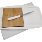 A rectangular serving platter with a bamboo cutting board on one side and a white handled knife placed on top. The platter is set on a plain white background.