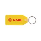A yellow rectangular keychain with the word RARE and a red emblem printed on it. It has a metal ring attached for holding keys.