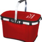 A red insulated picnic basket with a black zippered lid and a sturdy silver handle. The words Easy Travel Company are printed in white on the lid, accompanied by a design of five stars.