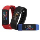 Three fitness trackers with colorful digital displays and rubber straps are shown. The bands are red, black, and blue, each displaying time, date, activity stats, and icons, against a white background.