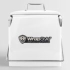 White box with a metal handle and latch. The box features a logo with a shield emblem and the text WrapStyle™ Premium Car Styling. The design is sleek and minimalistic on a light gray background.