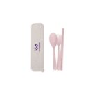 A pink reusable utensil set featuring a spoon, fork, and chopsticks, placed next to a beige case with a purple logo.