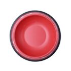 A round, red pet food bowl with a black outer rim viewed from above, isolated on a white background.