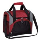 A red and black insulated lunch bag with a large zippered front pocket, two handles, and an adjustable shoulder strap. The bag has a rectangular shape and gray accents on the sides.