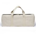 A beige rectangular fabric bag with handles and a zipper on top, standing upright. The bag has reinforced seams and a simplistic design, suitable for carrying items.