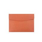 Simple orange rectangular envelope clutch with a flap closure on a white background.