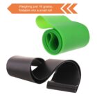 Two silicone bands, one green and one black, are rolled into compact spirals. An orange box in the upper left corner reads, Weighing just 16 grams, foldable into a small roll.
