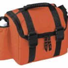 An orange and black duffel-style camera bag with multiple zippered compartments and adjustable straps. It features a padded handle and an external bottle holder on the side.
