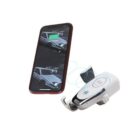 A smartphone with an image of a car on the screen hovers beside a white car phone mount. Blue lines suggest a wireless connection. The mount displays a charging symbol.