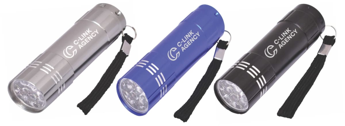 Three LED flashlights in silver, blue, and black. Each flashlight features a keychain strap and the text C-LINK AGENCY with a logo on the side. Theyre arranged in a row on a white background.