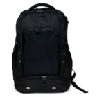 A black backpack with multiple zippered compartments and a mesh front pocket, designed for carrying personal items. It has a handle on top and adjustable shoulder straps.