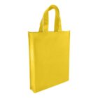A bright yellow reusable tote bag with two handles stands upright against a plain white background. The bag has a rectangular shape and a smooth texture.