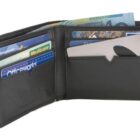 Open black wallet displaying various credit cards, a Medicare card, and cash. A small metallic tool is visible in one of the slots.