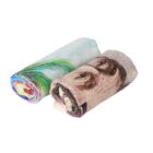 Two rolled towels: one featuring vibrant rainbow colors and a green feather, the other displaying a printed image of a face. The towels are placed side by side on a white background.