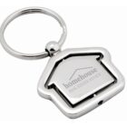 A silver, house-shaped keychain with the inscription homehouse REAL ESTATE ADVICE on it. The design features a rotating center with an outline of a house.