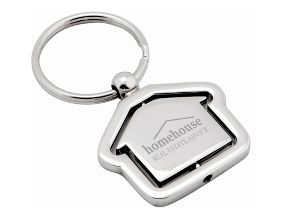 A silver, house-shaped keychain with the inscription homehouse REAL ESTATE ADVICE on it. The design features a rotating center with an outline of a house.