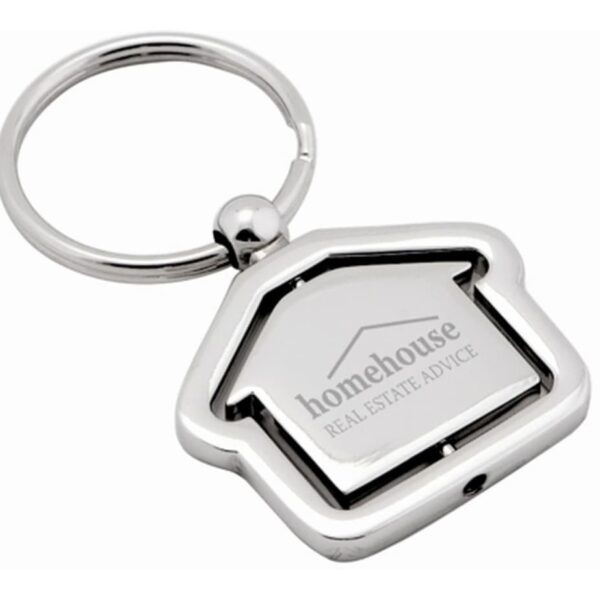 A silver keychain in the shape of a house, featuring the text homehouse REAL ESTATE ADVICE engraved on it. The keychain has a round ring attached.