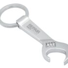 A silver keychain in the shape of a wrench with the words REPAIR MEN PR-LTD engraved on it. The opposite end features a keyring for attaching keys.