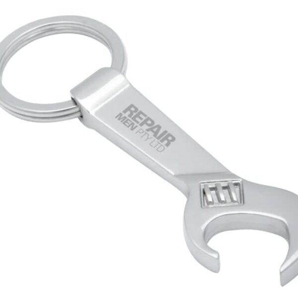 A silver keychain shaped like a wrench with the text REPAIR MEN engraved on it. The design combines a circular keyring with a bottle opener feature at the head of the wrench.