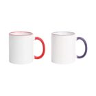 Two white mugs with colored handles and rims are displayed against a white background. The mug on the left has a red handle and rim, while the mug on the right features a purple handle and rim.