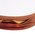 Close-up of a brown and red twisted fabric headband with a touch of yellow, set against a plain white background. The headband has a smooth texture, showcasing a blend of earthy tones.
