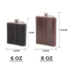 Two metal flasks with leather coverings. The left flask is black, 6 ounces, and 11 cm tall. The right flask is brown, 8 ounces, and 13.9 cm tall. Both are 9.3 cm wide, with screw tops and visible stitching on the leather.