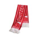 Red and white Switzerland scarf featuring the word SWITZERLAND in bold letters. It has white fringe at the ends and a design with a Swiss flag and emblem.