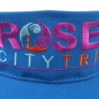 Blue hat with colorful embroidered text and nautical-themed design.