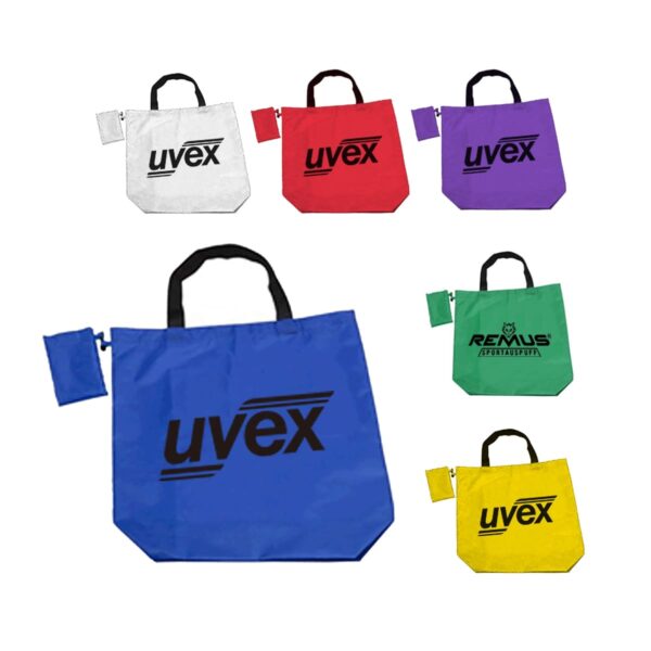 A collection of foldable tote bags in white, red, purple, blue, green, and yellow, each with black handles. The bags feature the brand logos uvex and REMUS in bold letters.