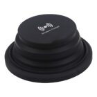 A black wireless charger with a coil design and a wireless charging symbol on top. The words Wireless Charger are printed beneath the symbol. It has a round, compact shape.