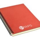 A spiral-bound notebook with a red cover displaying the word MAPS in white text and a circular logo. The pages are slightly visible, and the notebook is angled on a white background.