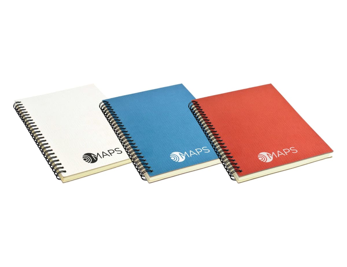Three spiral-bound notebooks are arranged side by side. The notebooks have covers in white, blue, and red, each marked with the MAPS logo. The notebooks are aligned horizontally.