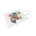 White tote bag featuring a colorful graphic of a cartoon character with a cap and goggles, surrounded by stars and text.