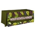 A green table cover with grape clusters and leaves along the edges. The words Wolff Estate & Winery are prominently displayed in white lettering at the front.